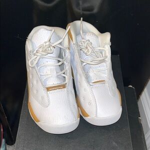Jordan 13 Retro White and Gold Sneakers